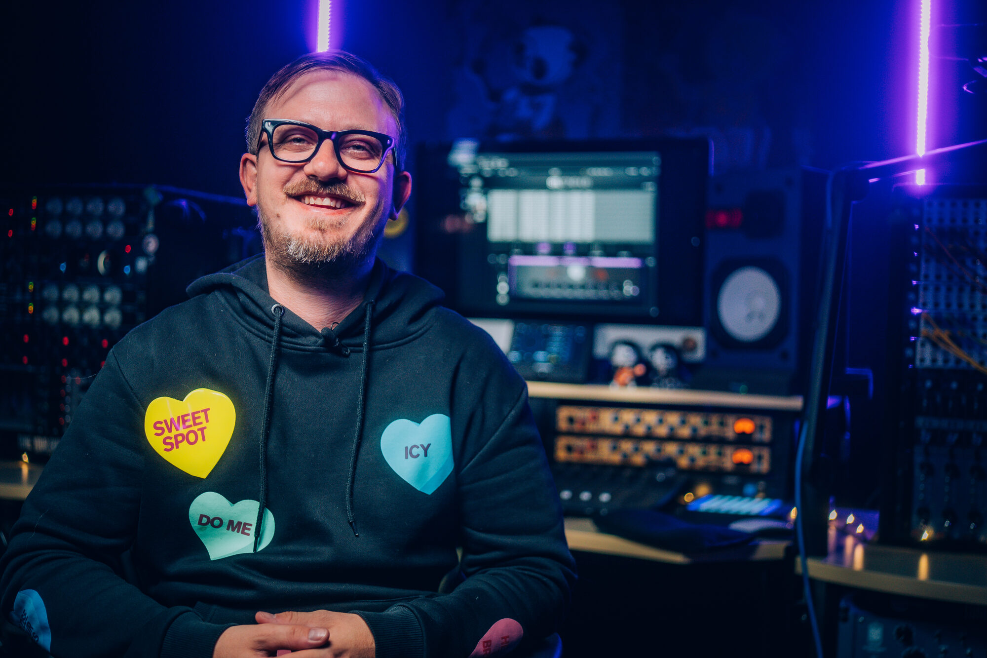 Sam Pura smiling in the studio