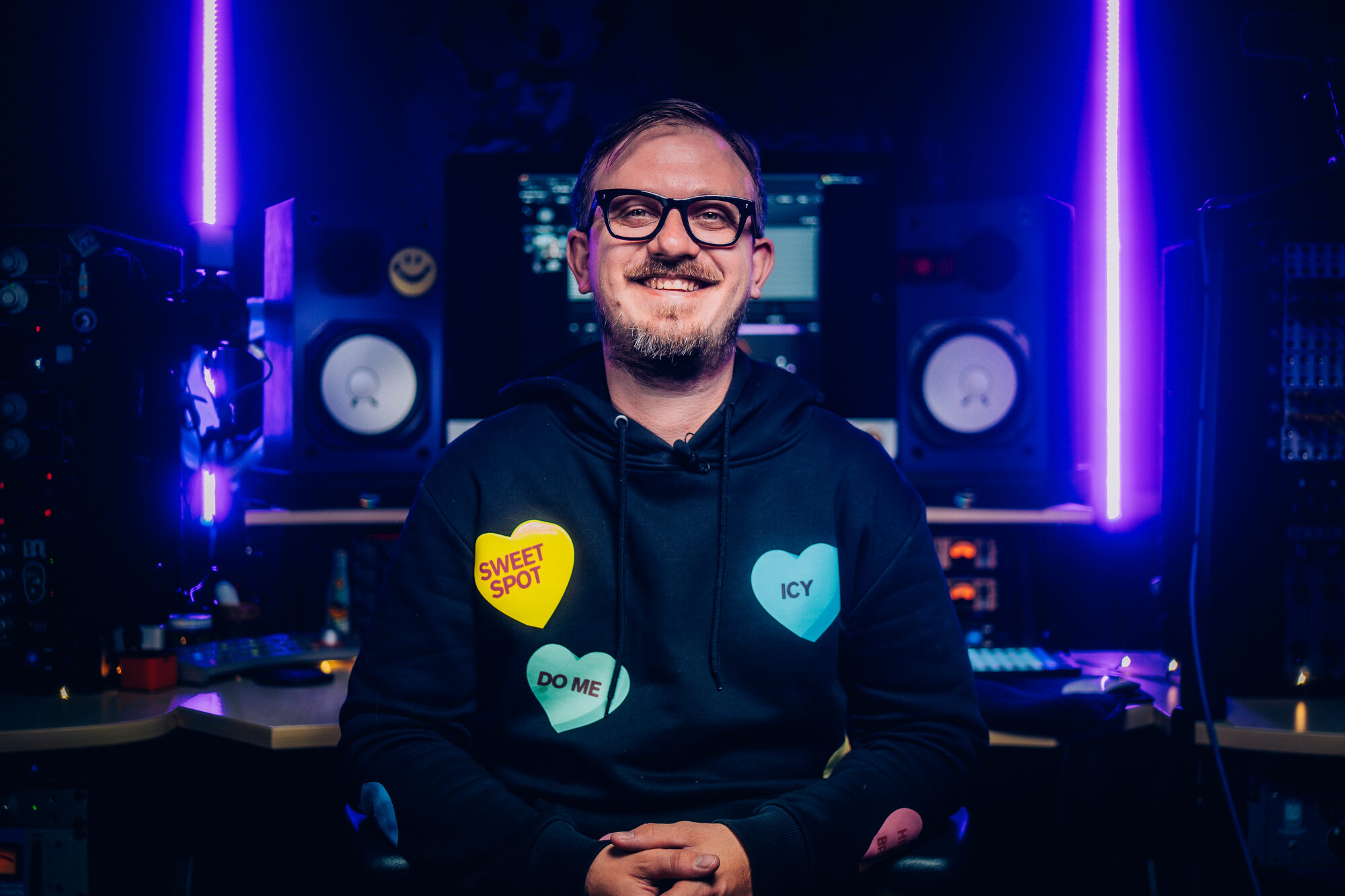 Sam Pura in his studio, blue and purple console lighting