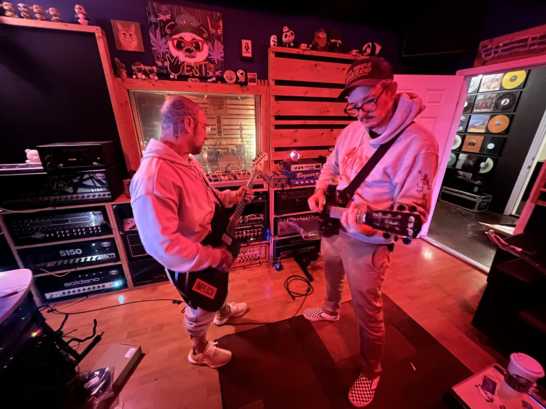 Working through guitar parts in the studio